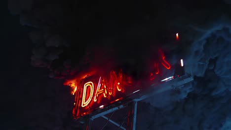 danger neon sign with smoke