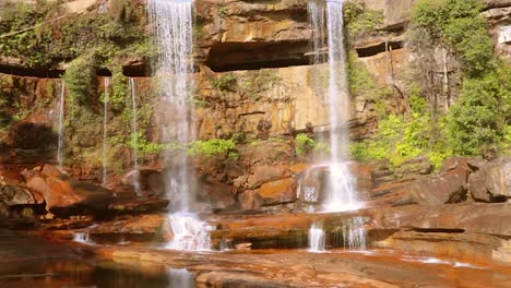 pristine natural waterfall falling from mountain top at forests at day from different angle video is taken at phe phe fall meghalaya india