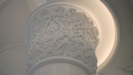 ornate white column and ceiling detail