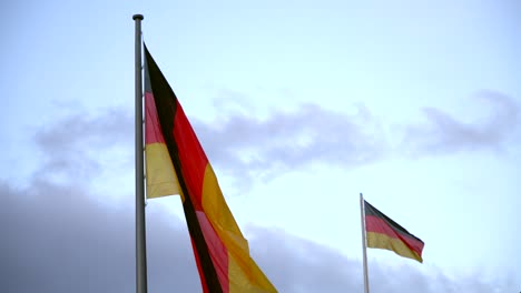 two german flags in the wind