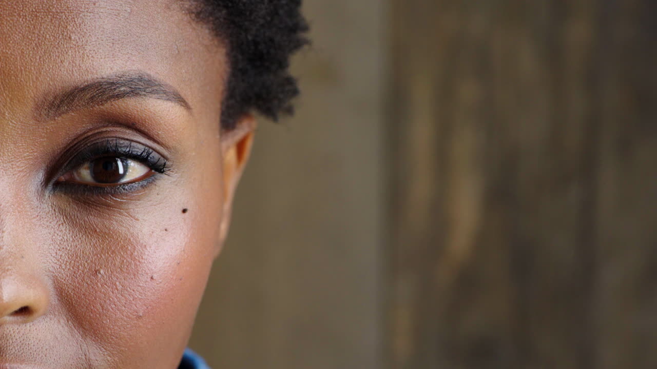 Closeup eye of an African woman with an afro