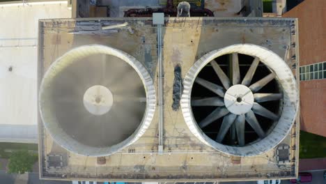 industrial air conditioning unit fans rotating on hot summer day