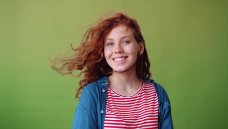 smiling teenage girl with red curly hair