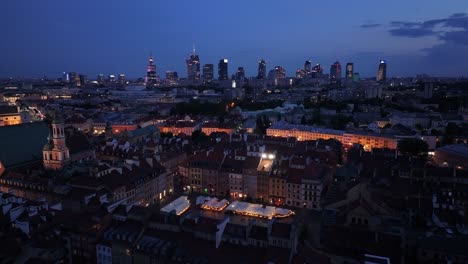 warsaw's old town at night, lights in the windows, the beautiful architecture of old warsaw and modern skyscrapers in the background, a meeting of old culture and modern design