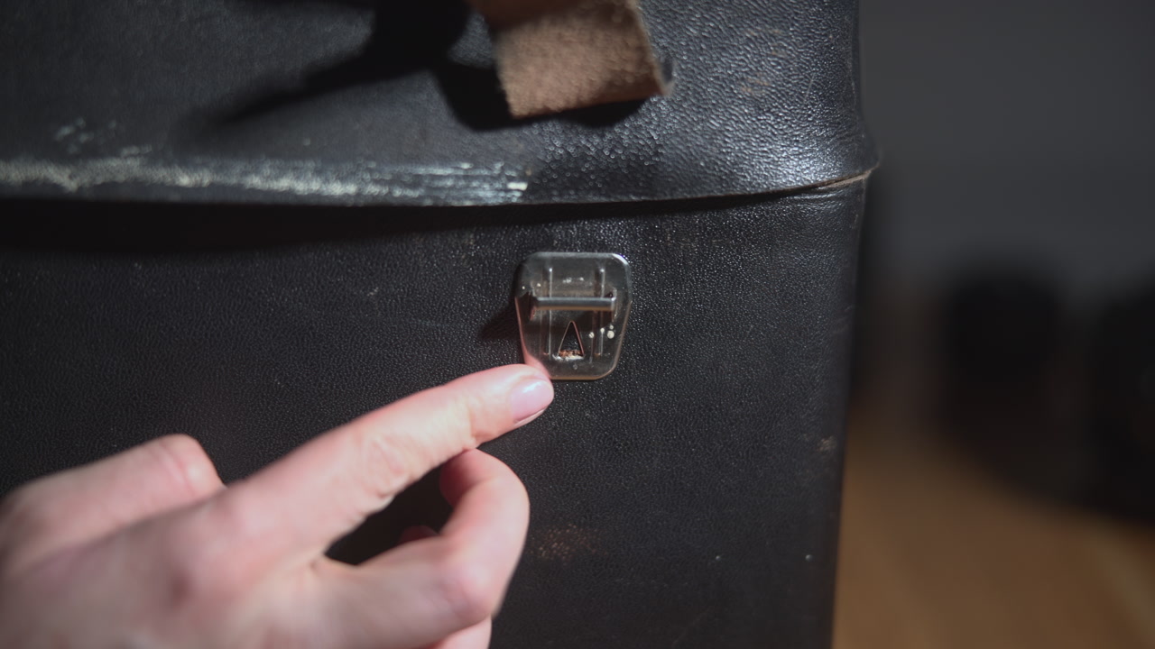 Conservation Hands Gently Release Metal Latch On Case, Deliberate Restoration Motion, Delicate Touch, Workshop . Media