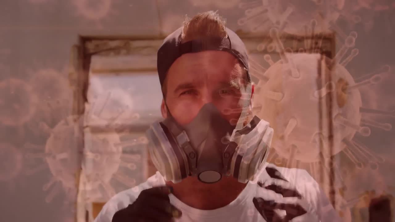 코로나19 세포가 배경에 가스 마스크를 착용한 남성에 퍼지고 있습니다.