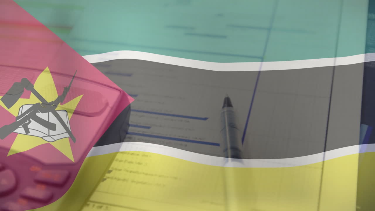 Mozambique flag overlaying financial documents, pen and calculator on school desk