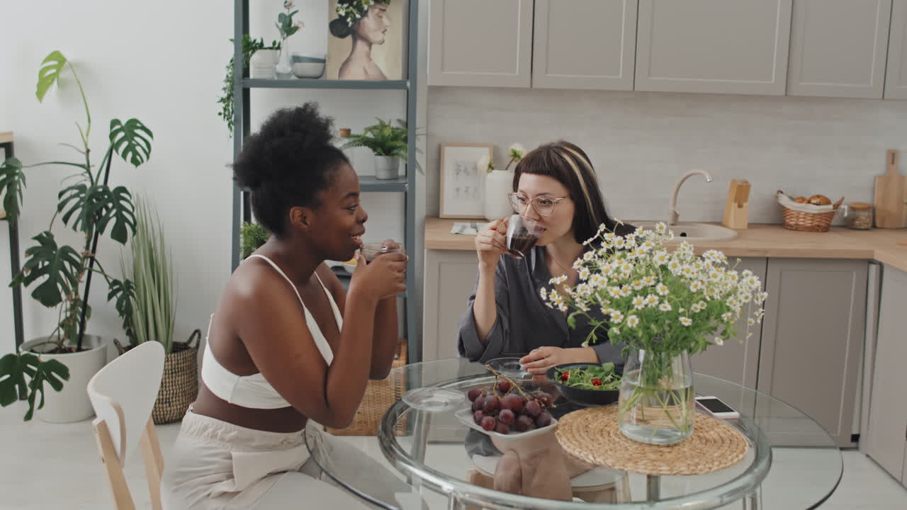Lesbian Couple Enjoying Coffee in Cozy Kitchen