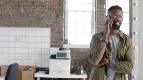 Happy-african-american-casual-businessman-talking-on-smartphone-in-slow-motion