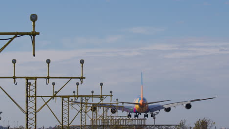 colorful a380 landing at airport