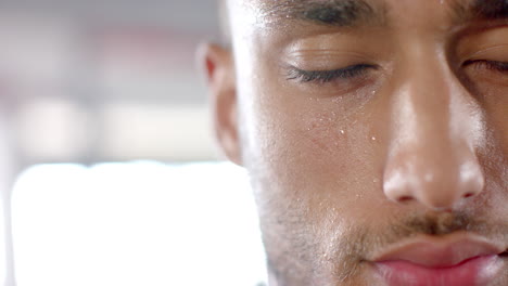 sweating and focusing, man in gym during intense workout session, copy space