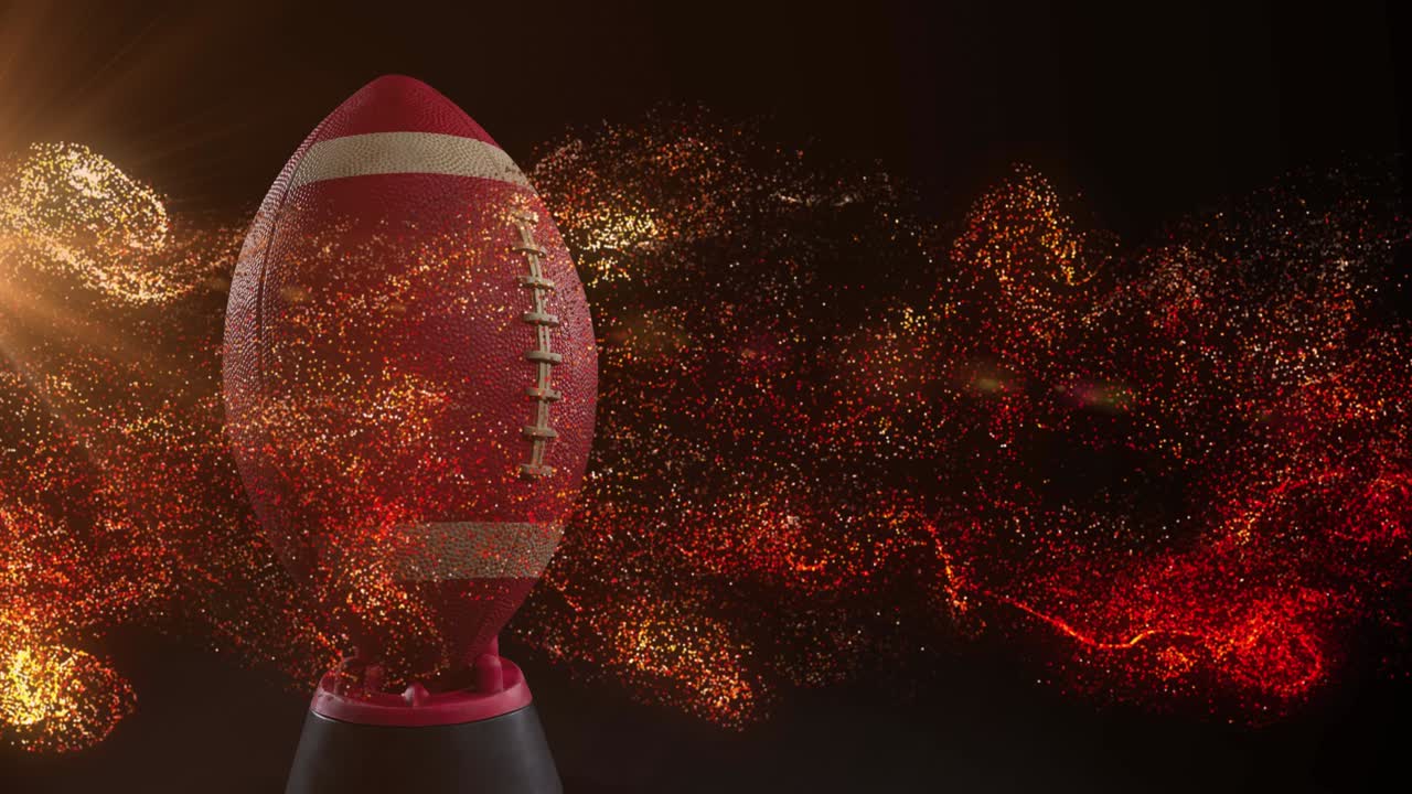 럭비 공 위에서 움직이는 반 ⁇ 이는 오렌지색 입자의 애니메이션