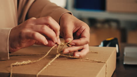 E-commerce storage shop, woman packing goods and clothes for second hand delivery market, dedicated Packaging and Shipping Workspace with Supplies and Technology for efficiency, online sales.