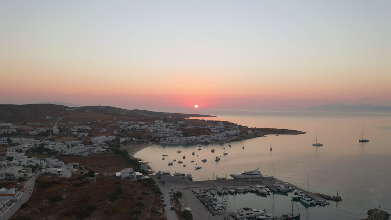 Ano Koufonisi island in Koufonisia, Chora village port at sunset, Cyclades islands, Aegean Sea, Drone shot