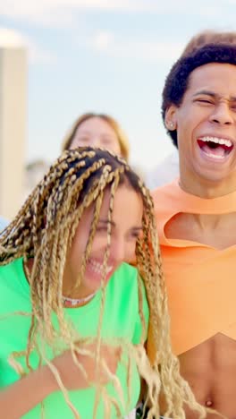 happy multi-ethnic friends strolling and smiling together along a promenade