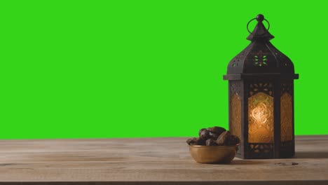 Wide-Shot-of-Lantern-Dates-and-Water-In-Front-of-a-Green-Screen