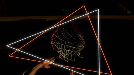 animation of orange and white neon triangles over basketball player scoring hoop