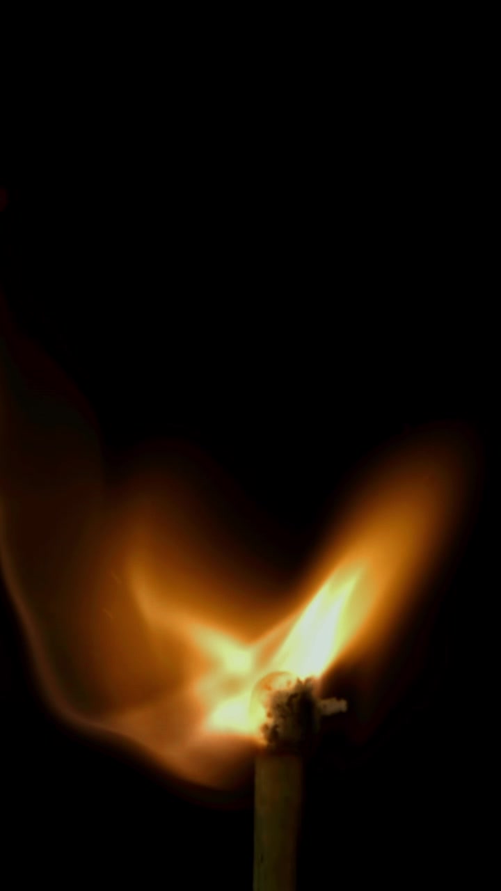 Slow Motion Close-Up of a Matchstick Igniting and Burning