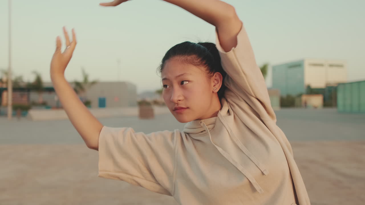 Asian woman stretching outdoors