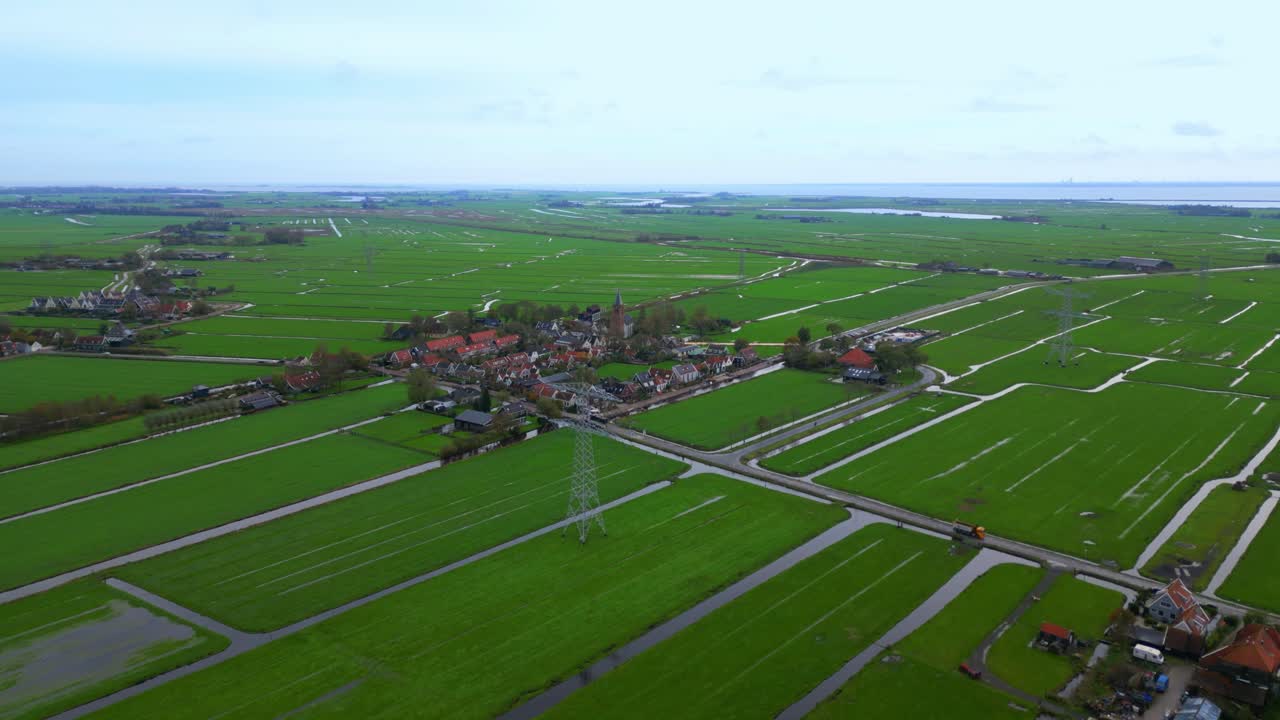 Approaching traditional Dutch village Zunderdorp in Polder by drone
