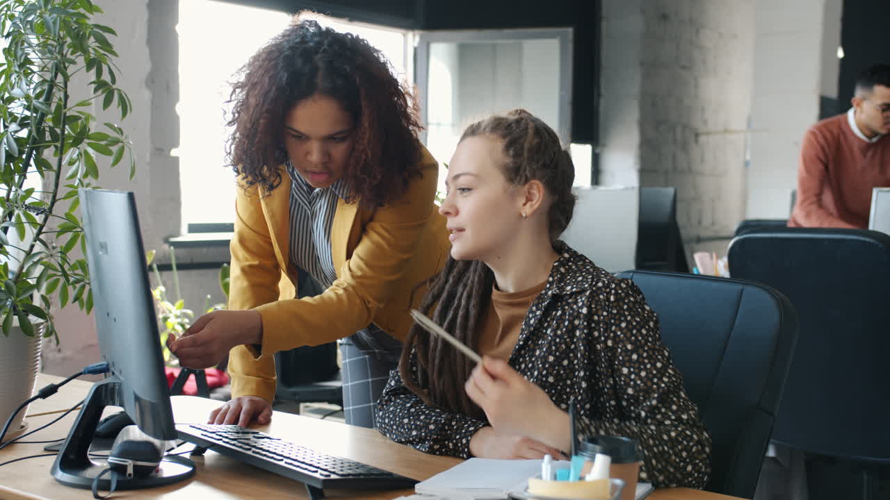 Two Women Working Together on a Computer