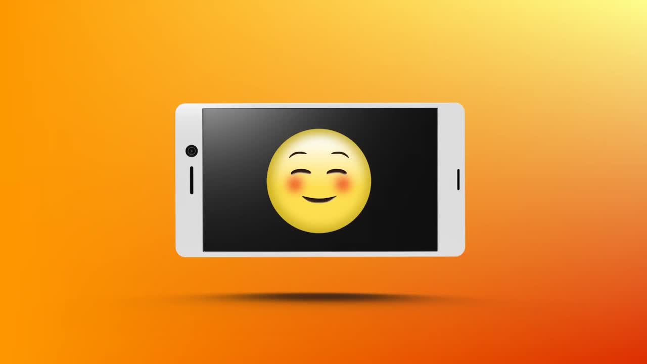 teléfono inteligente con un emoji sonriente en su pantalla