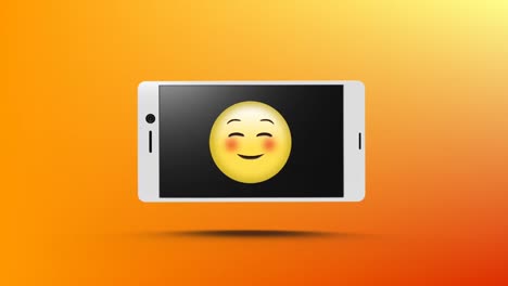 smart phone with a smiling emoji on its screen