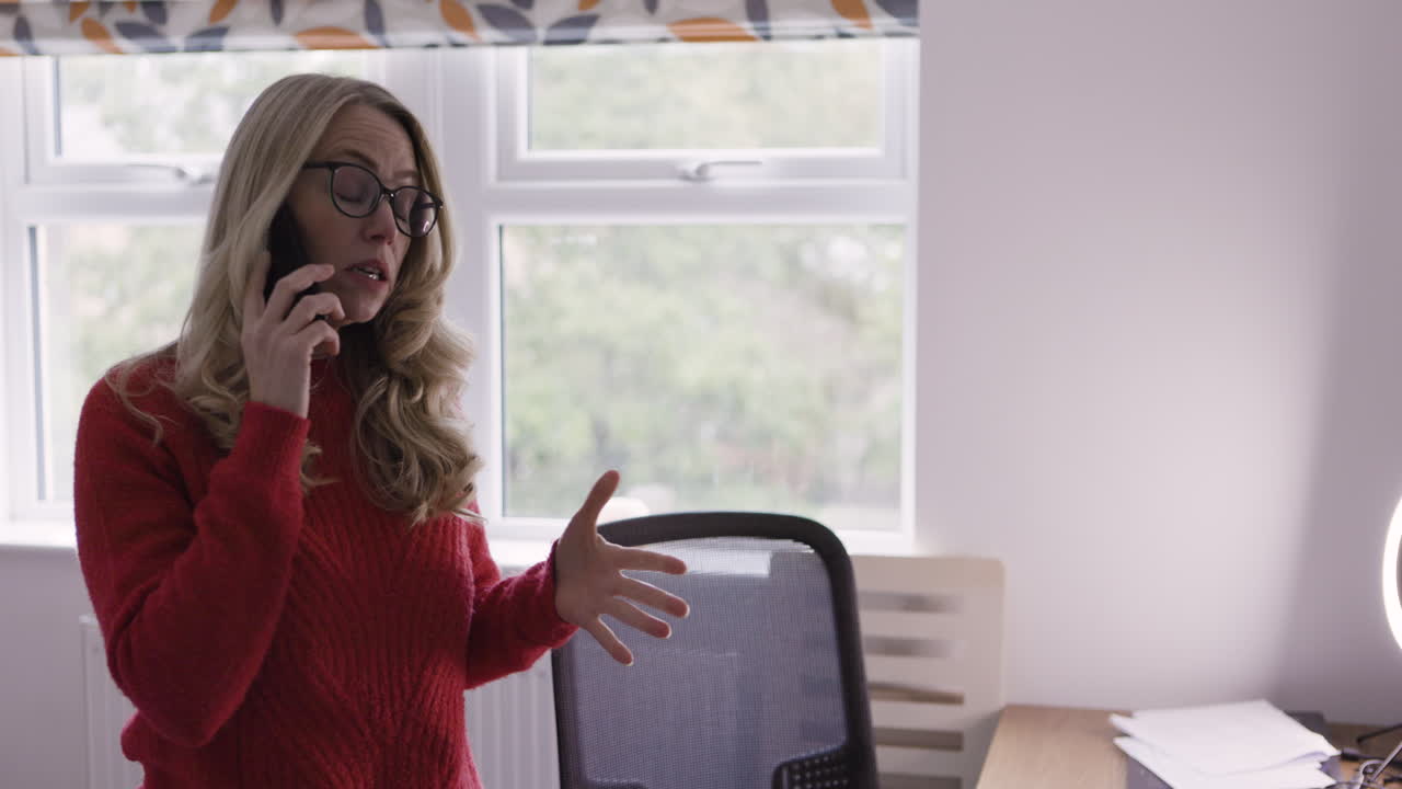 Woman talking on the phone in an office