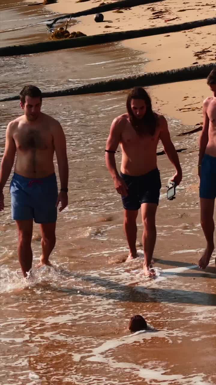 Men walking on a beach