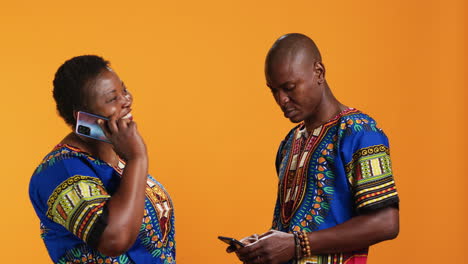 cheerful couple talking to family on phone call