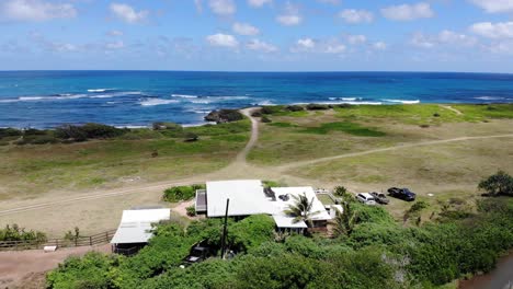 aerial drone shot of the pacific coastline and natural vegetation around north shore oahu