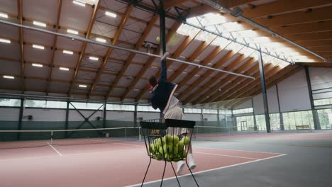 man playing tennis indoor