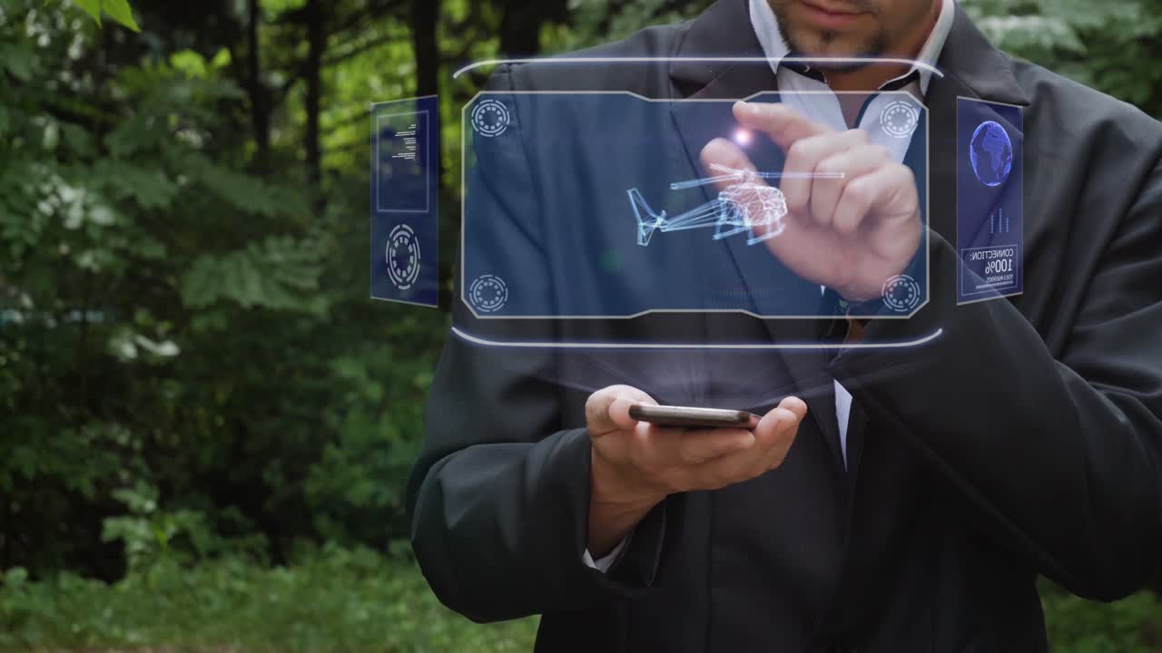 사업가가 헬리터로 홀로그램을 사용합니다.