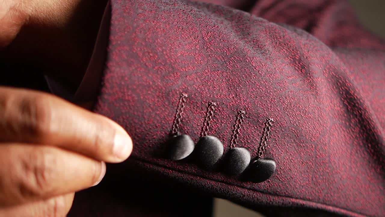 Close-up of a Man's Red Suit Sleeve