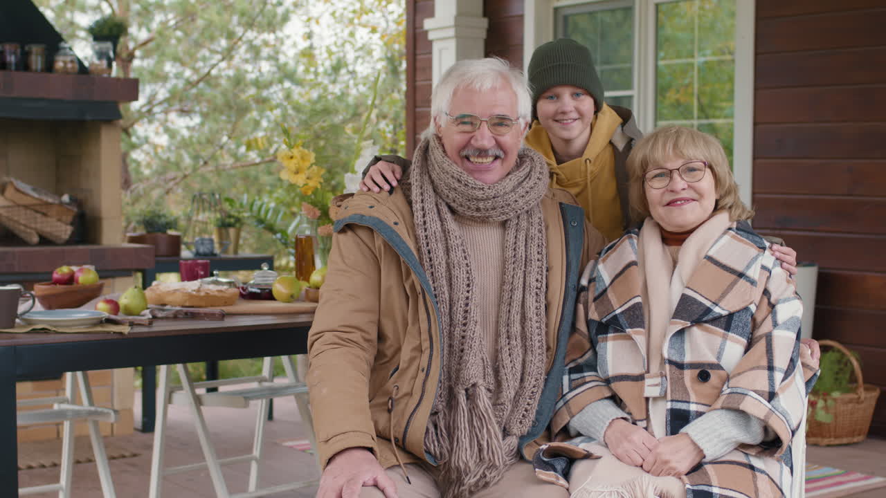 Happy Senior Couple and Their Grandson