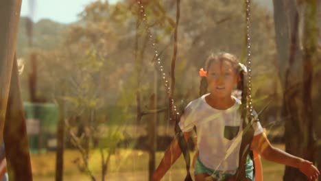 Two-girls-playing-on-the-swing