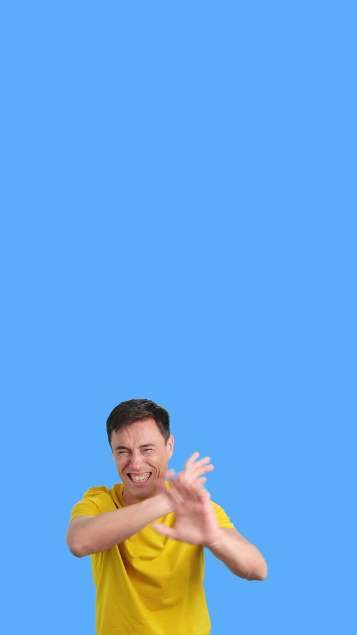 Man with Negative Facial Expression on Blue Background