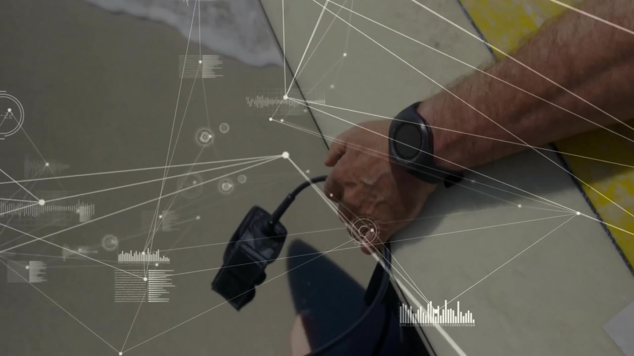 Man threading waterproof tracker into surfboard plug, lifting board to shore, testing data overlay