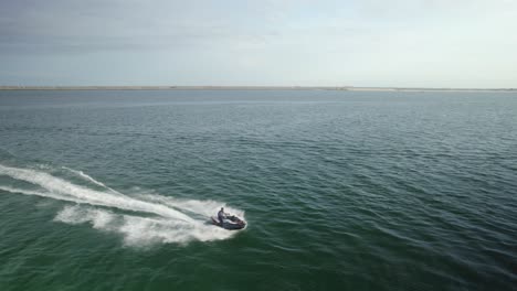 man riding a jetski in the water