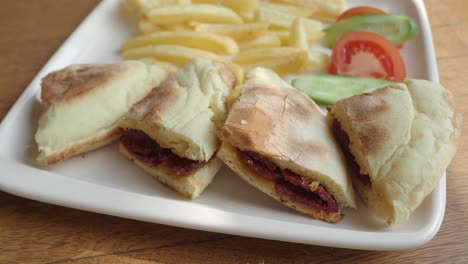 turkish sandwich with fries and salad