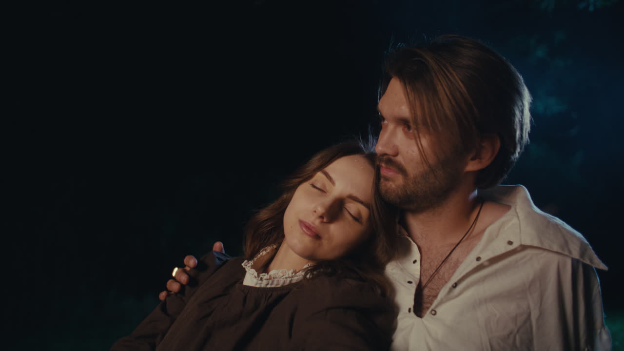 A Couple Embracing Peacefully at Night