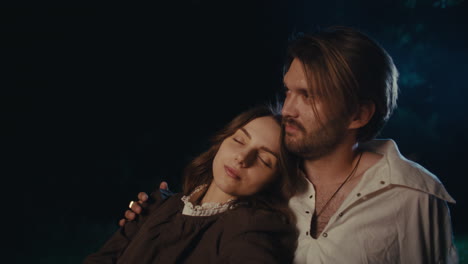 a couple embracing peacefully at night