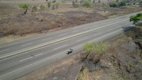 freedom on the road: motorcyclist on vast venezuelan highway