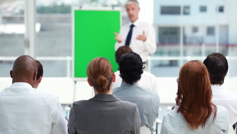 businessman speaking with a board