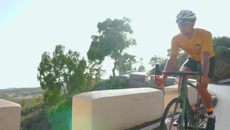 a man cycles on a road bike during the morning, enjoying outdoor exercise on a deserted road. the slow-motion portrayal enhances the sense of extreme sports