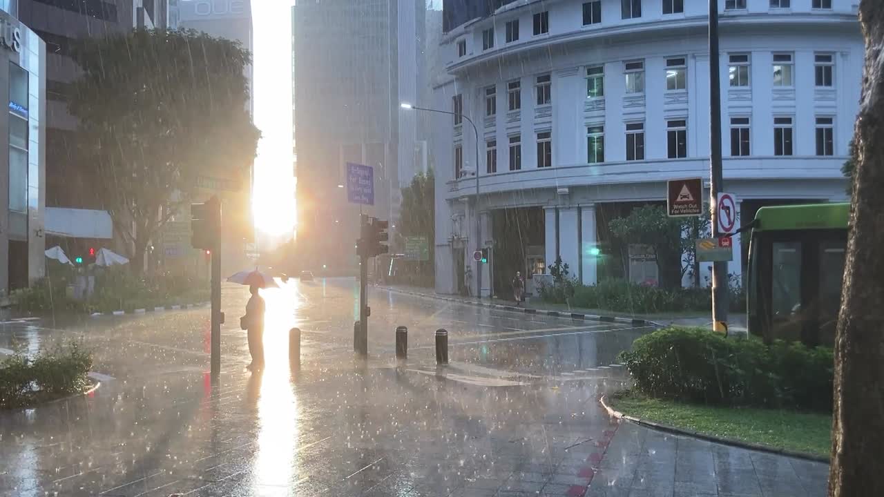 Sun flare during sunrise just after heavy rain showers in the city