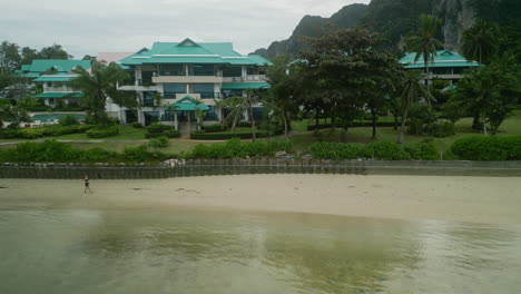 tropical beach resort with mountains and clear water