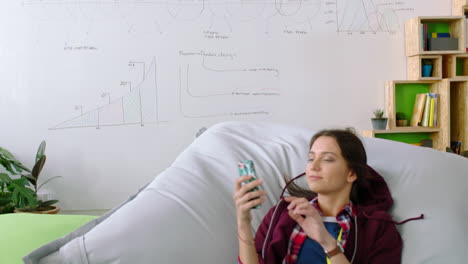 Pillow,-relax-and-creative-student-with-smartphone