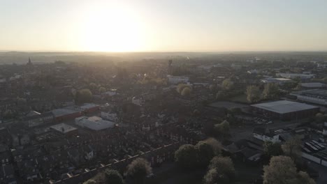 drone aerial view above british sunrise typical housing silhouette skyline
