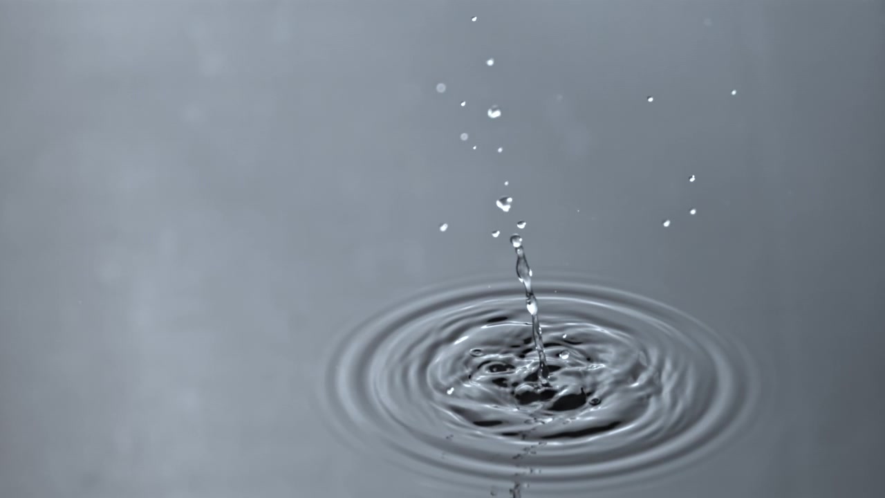 Slow Motion Water Droplet Falling and Creating Ripples